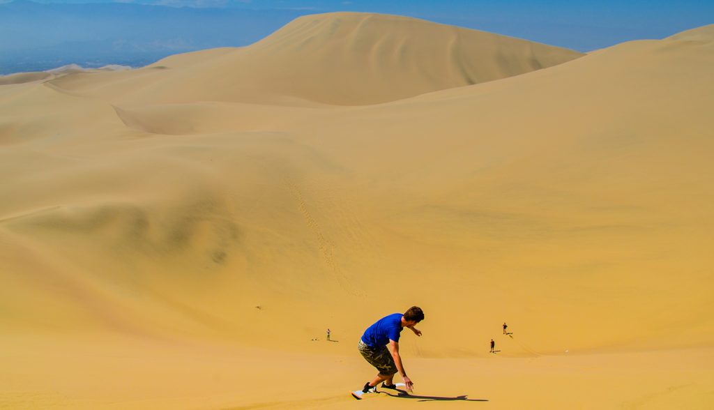 Sand-boarding fun on Atacama Desert, Oasis of Huacachina Sand-boarding fun on Atacama Desert, Oasis of Huacachina