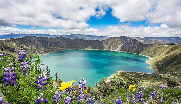 Beautiful panoramic scenery overlooking at Quilotoa lake at the crater rim in Quilotoa, Ecuador Beautiful panoramic scenery overlooking at Quilotoa lake at the crater rim in Quilotoa, Ecuador