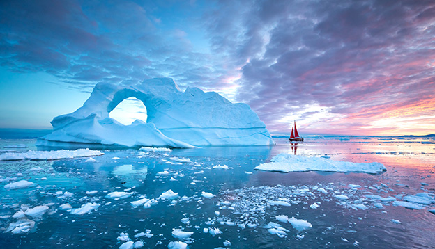 A Sail boat provides perspective in the Arctic A Sail boat provides perspective in the Arctic