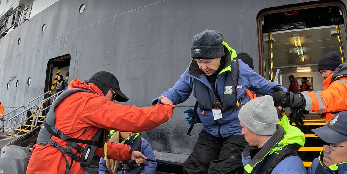 Chimu guest boards a zodiac in Antarctica. Chimu guest boards a zodiac in Antarctica.