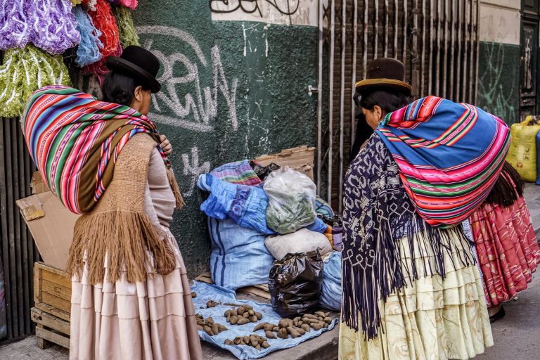 Native women in traditional dress in the market Native women in traditional dress in the market