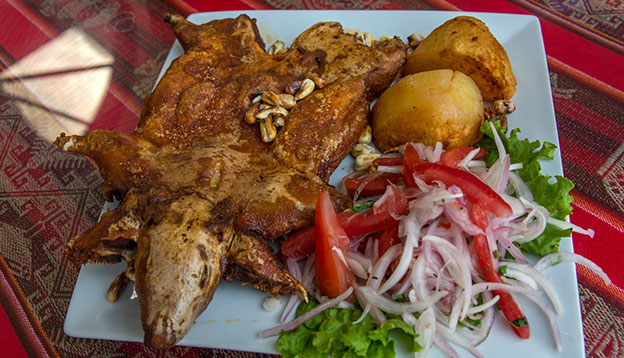 A plate of Cuy (Guinea Pig) a dish served in Peru A plate of Cuy (Guinea Pig) a dish served in Peru