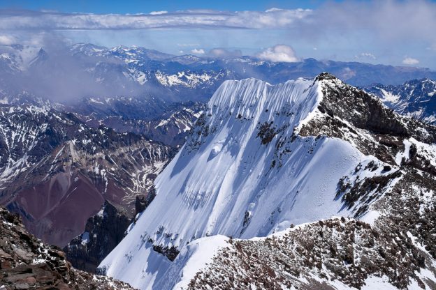 Mighty Aconcagua: view of the southern peak, from the northern peak. Mighty Aconcagua: view of the southern peak, from the northern peak.