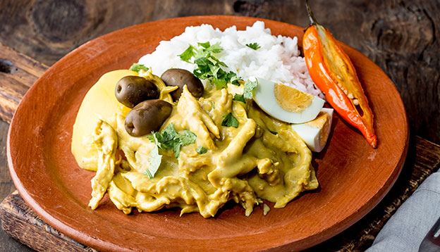 Close up of Aji de Gallina - Peruvian Yellow Spicy Creamy Chicken. Close up of Aji de Gallina - Peruvian Yellow Spicy Creamy Chicken.