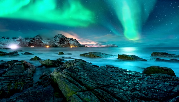 Aurora borealis above the snowy islands of Lofoten. Aurora borealis above the snowy islands of Lofoten.
