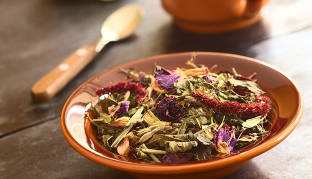 Horchata – a traditional Ecuadorian tea made of 28 different herbs in a bowl Horchata – a traditional Ecuadorian tea made of 28 different herbs in a bowl