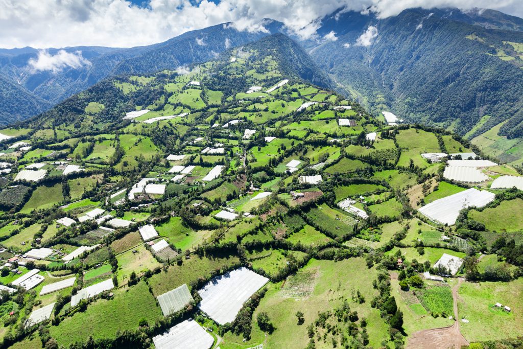 Banos de Agua Santa and Tungurahua Volcano in the background in Ecuador Banos de Agua Santa and Tungurahua Volcano in the background in Ecuador