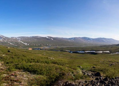 Torngat Mountains National Park in summer with snowy patches and blue skies in the Canadian Arctic) 