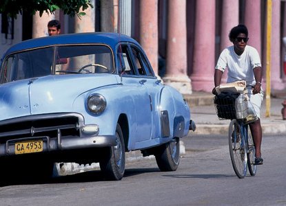  CCL_banner_cuba_camaguey_woman_bike_car 