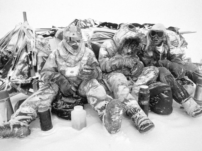Polar explorers having a meal
