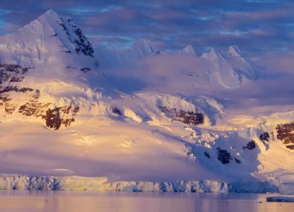 Snow-covered mountains in the background at sunrise in Antarctica) 